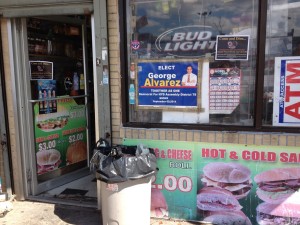 George Alvarez campaign posters are ubiquitous in the 79th District, including at this corner store on Prospect Avenue in Morrisania. (DANNY FUNT / The Bronx Ink) 