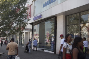Shoppers pass by Claire's jewelry store on East Fordham Rd in the Bronx.