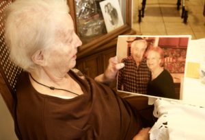 Sally Schulman looks at the last photo taken of her husband, Joseph Schulman, a Holocaust survivor who died in 2010.
